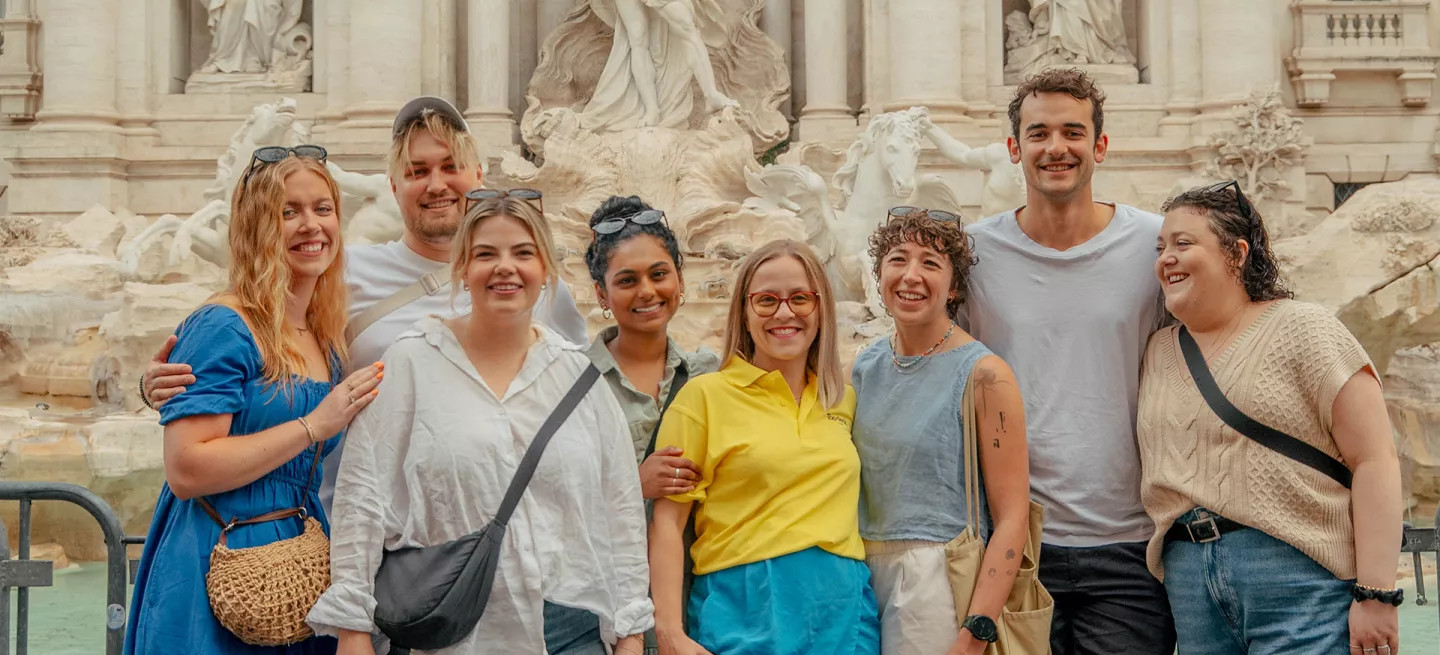 Topdeck customers in front of the Trevi Fountain in Rome - trip on sale now.