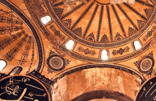 A view of one of the grand domed ceilings of the Hagia Sophia, one of the world's most iconic religious sites located in Istanbul.