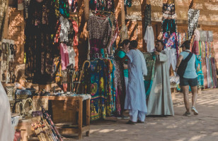 A hawker selling his clothing wares in one of Egypts many markets.