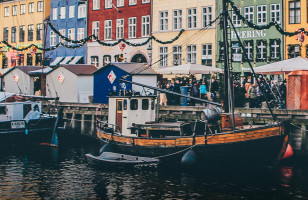 Boats and colorful houses like the docks of Nyhavn harbour in Copenhagen.