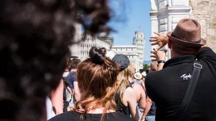 A view of crowds of people at Pisa, eager to see the Leaning Tower.