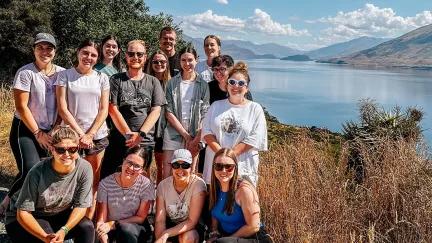 Topdeck tour group posing for a photo during their tour across Mou Waho Island.
