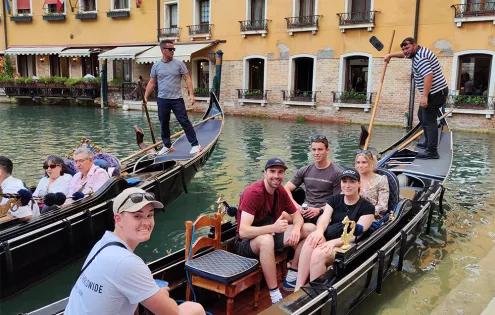 Topdeck travellers onboard a gondola, about to cruise through the iconic canals of Venice.