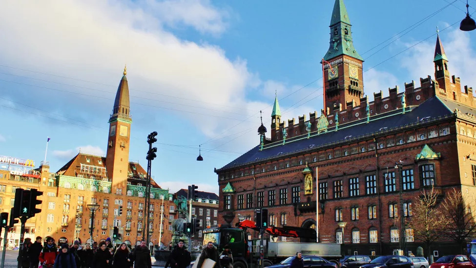 View of Copenhagen City Hall with crowds of people outside.