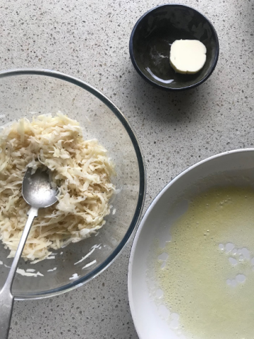 Ingredients in bowl, butter in another side bowl and a bigger bowl with melted butter in it