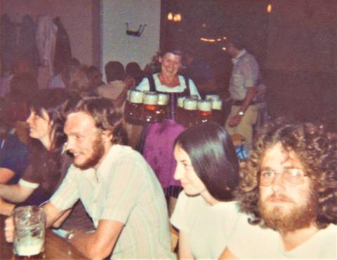 people in a pub drinking beer