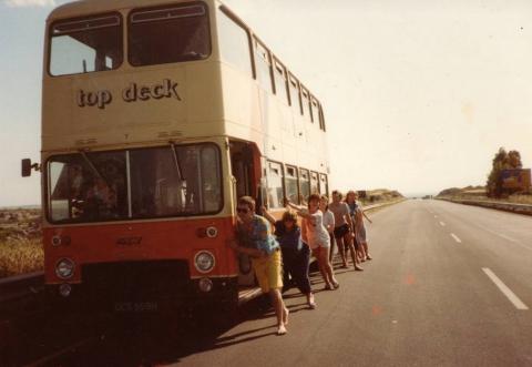 Passengers pushing the Topdeck bus