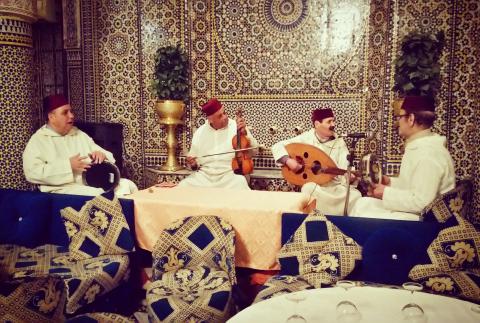 Four men playing instruments