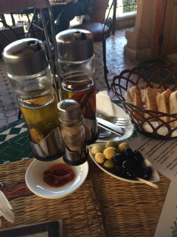 Olive oil and olives in a bowl
