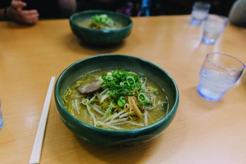 A bowl of ramen with toppings