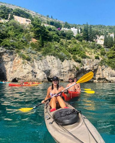 A woman smiling on a canoe boat in Croatia