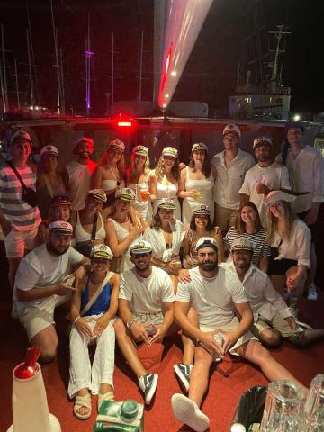 A group of topdeckers on a sail and swim boat