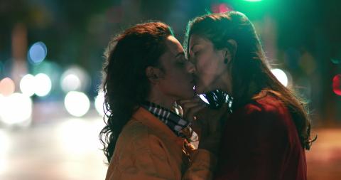 Two women kissing 