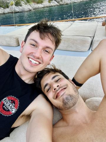 A selfie of two men smiling