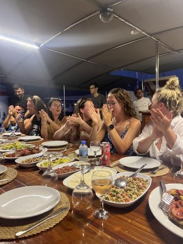 Group of people eating dinner at the table