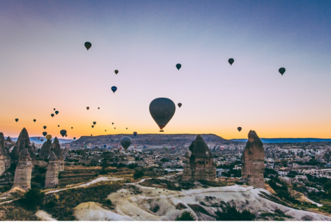 Hot air balloons in the sky during sunset in Turkey