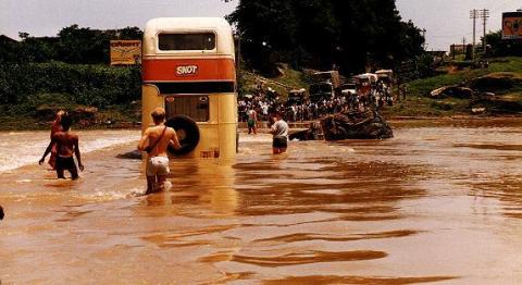 A topdeck bus immersed in a flood in India