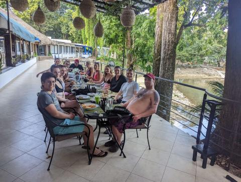 A group of people having dinner outside 
