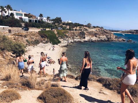 Girls walking down to the beach in Greece