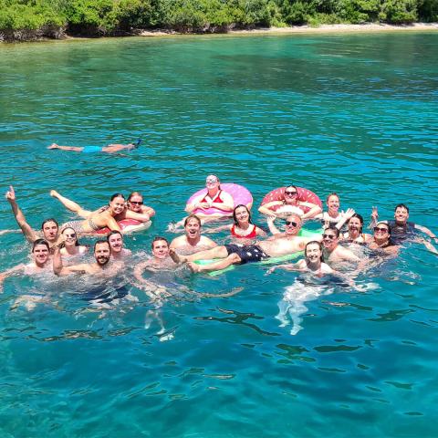 A group of topdeckers swimming in the sea in Turkey