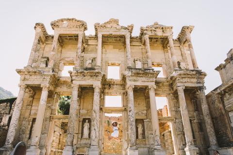Woman jumping in an ancient Turkish building