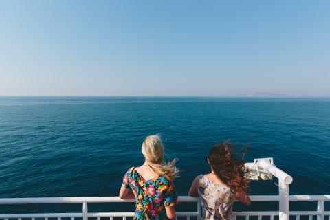 Two women staring out to sea