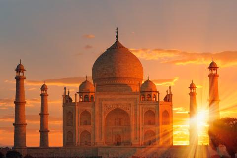 The Taj Mahal with a glowing sunset behind it