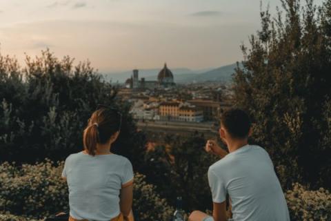 Two people sitting looking out at Florence