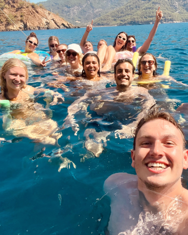 A selfie of a group of people swimming in the Mediterranean Sea in Turkey
