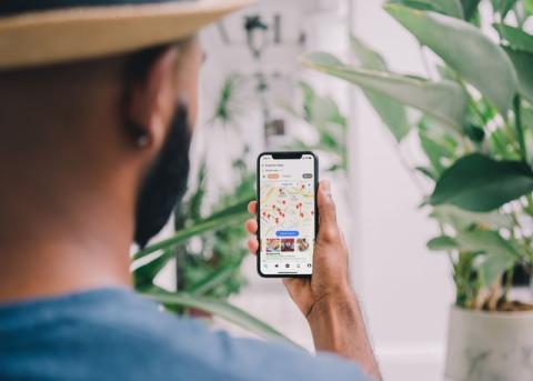 A man looking at maps on his phone 