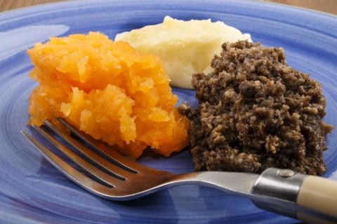 A plate of Haggis with sides