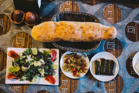 plates of turkish mezze and a baguette