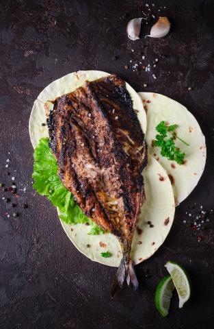 Smoked mackerel on wraps and lettuce