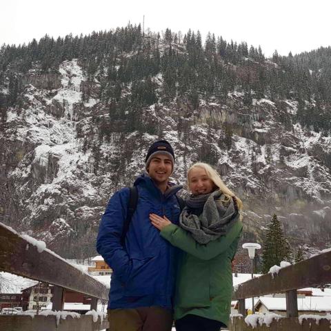 Couple in front of snowy mountains