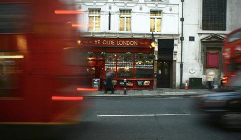 the pub front of Ye Olde London, with a bus driving past