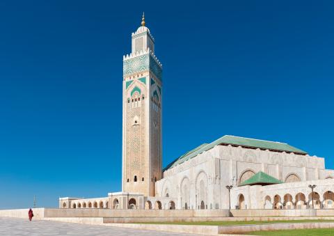 A Large mosque in Morocco. The sky behind is bright blue