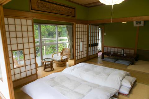 sliding doors and a futon on the floor in an authentic Japanese house