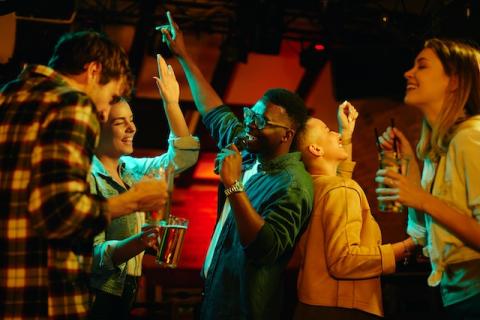 People singing and dancing in a club
