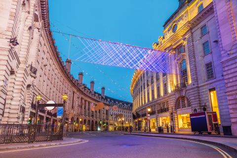 Oxford street in London, lit up by glowing lights 