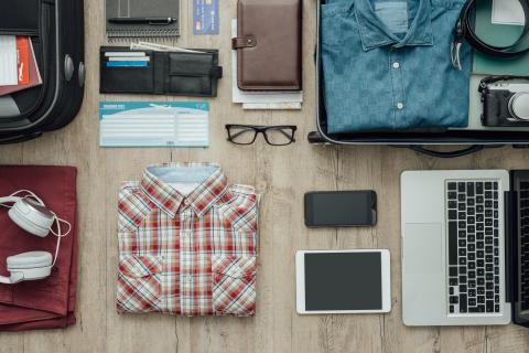 Items neatly folded and laid out ready to be packed in a suitcase