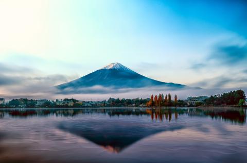 A Japanese mountain with the sea below it 