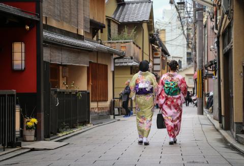 Two women in Kyoto walking down the street