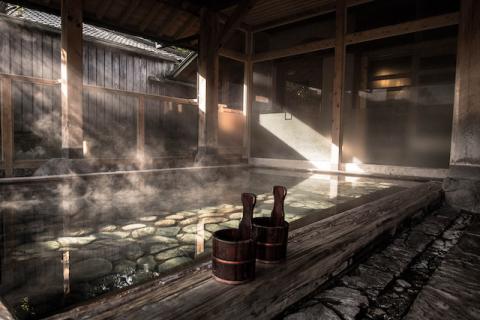hot spring with steam coming off it in Japan