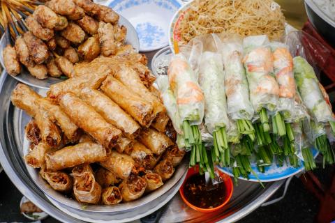 Plates and bowls of spring rolls
