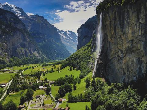 Swiss mountains, waterfall, bright greenery