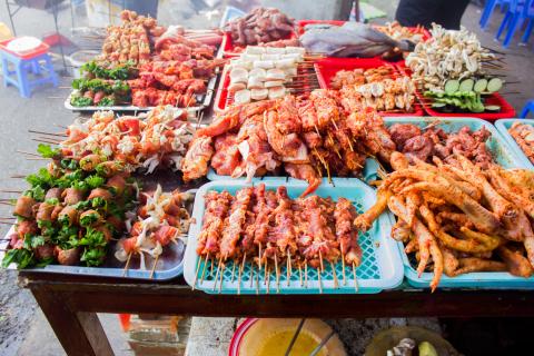Plates of meat on skewers for a barbecue 