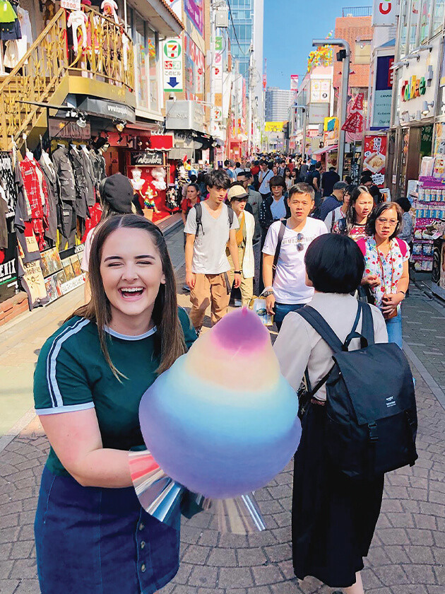 Topdeck travelers enjoying sugary treats in Tokyo.