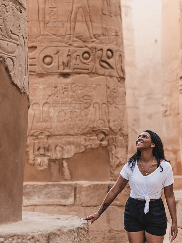 A Topdeck traveler exploring an ancient middle eastern ruin.