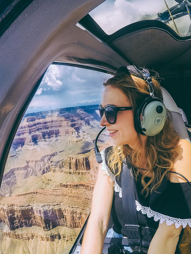 Topdeck traveler on a helicopter tour looking over the Grand canyon.