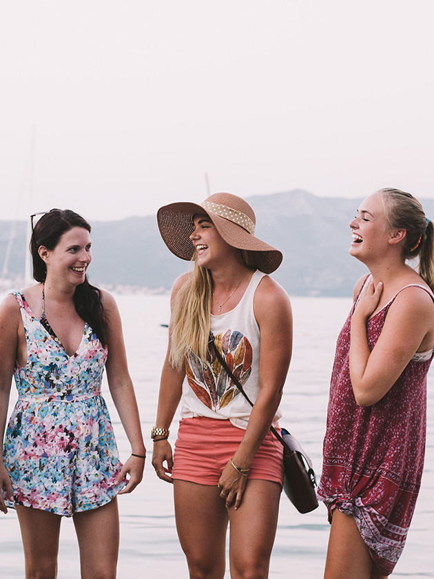 Todpeck travelers laughing together with the Blue Lagoon in the background.